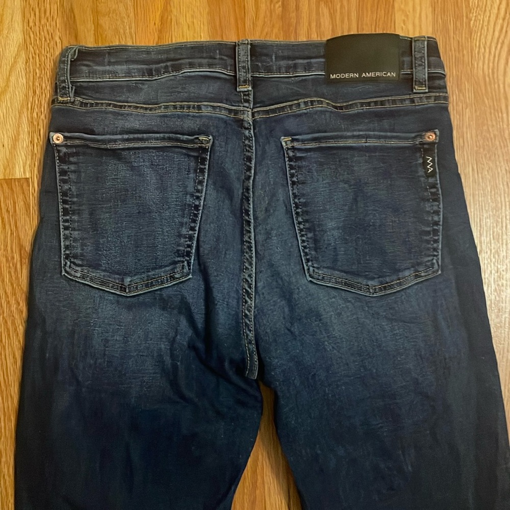 Modern American stretchy denim with copper accents size 31.